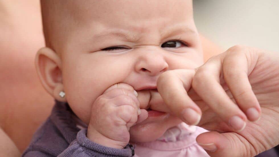 Looking for baby teething remedies that actually work? This is a comprehensive list of teething remedies to choose from. They include natural homemade remedies like frozen breast milk, DIY baby popsicles, remedies with essential oils, etc. These remedies can be used at nighttime for sleep, for 4 months old and beyond for toddlers, for molars, for your infant. Pin it. #teething #remedies