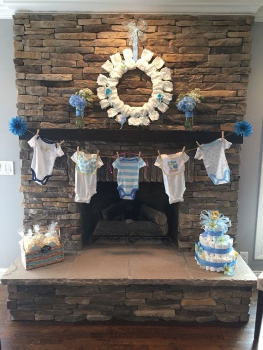 Baby shower clothesline clothespin decoration with onesies. CUTENESS!