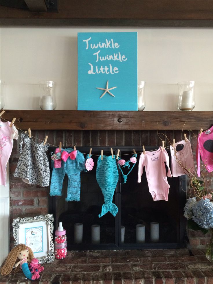 Baby shower clothesline clothespin decoration with onesies. CUTENESS!