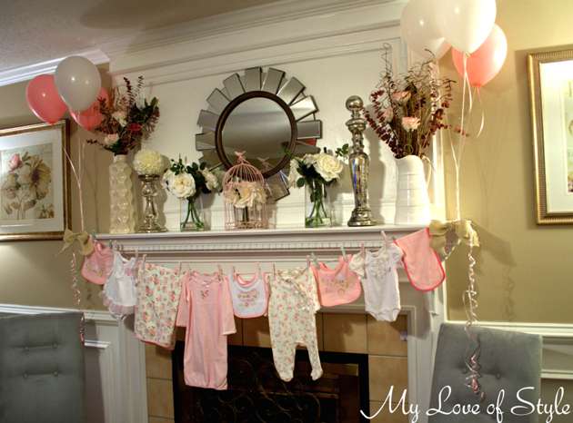 Baby shower clothesline clothespin decoration with onesies. CUTENESS!