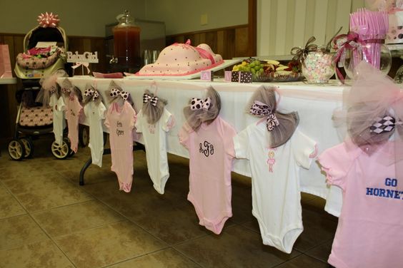 Baby shower clothesline clothespin decoration with onesies. CUTENESS!